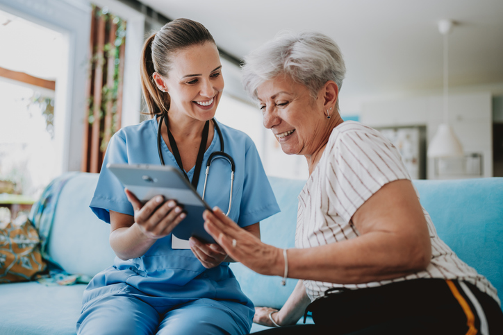 Caregiver helping patient with virtual care.